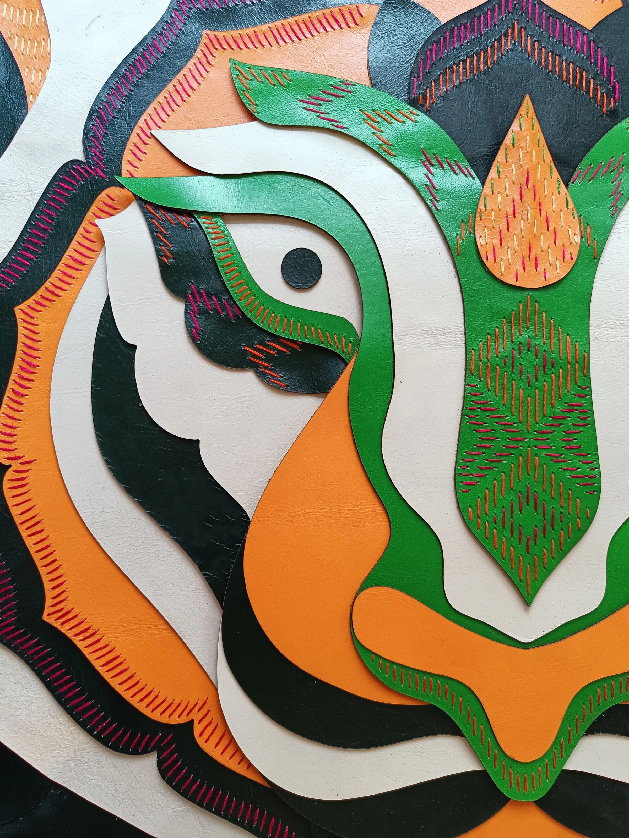 Detail of the leather and Phulkari embroidery installation at Starbucks Model Town, Jalandhar